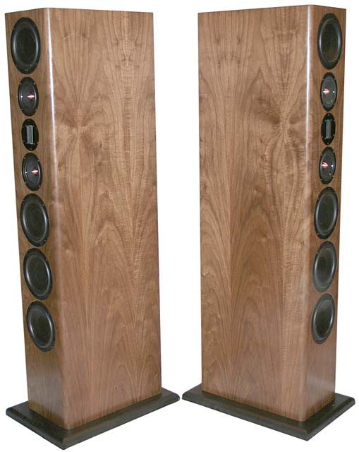 Pair of Apex tower speakers in figured wood veneer, angled to show the column of drivers on each front baffle